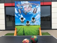 Milk can tossing